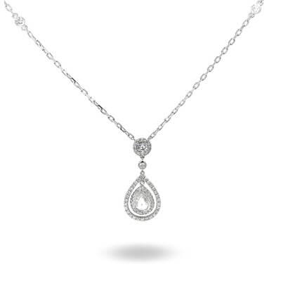 Private Diamond Collection in Dubai Teardrop Necklace: A silver chain showcases a teardrop pendant featuring a central gemstone surrounded by smaller stones, all elegantly hanging from a single round gemstone.